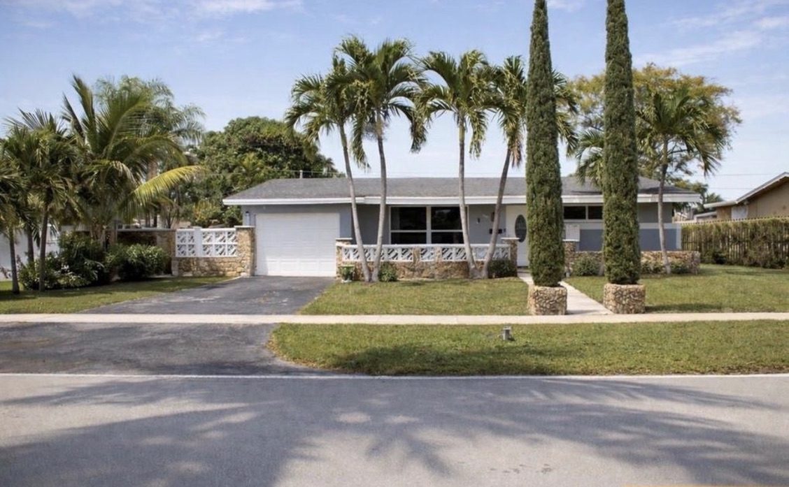 Front exterior with palm trees
