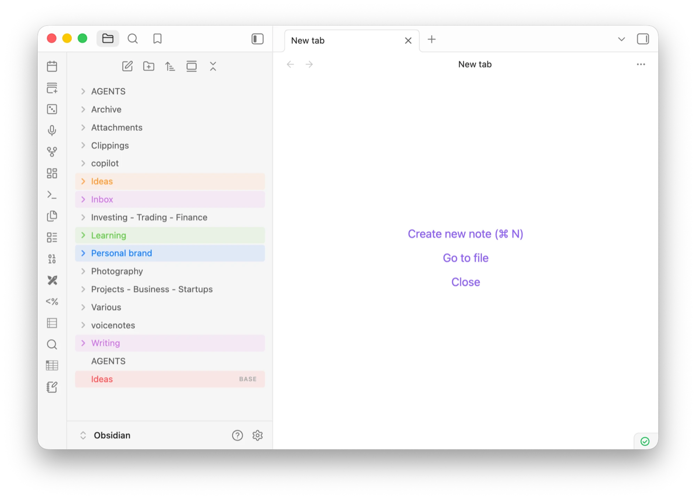 Color Tags in the Obsidian file explorer, showing folders tinted orange, purple, green, blue and red