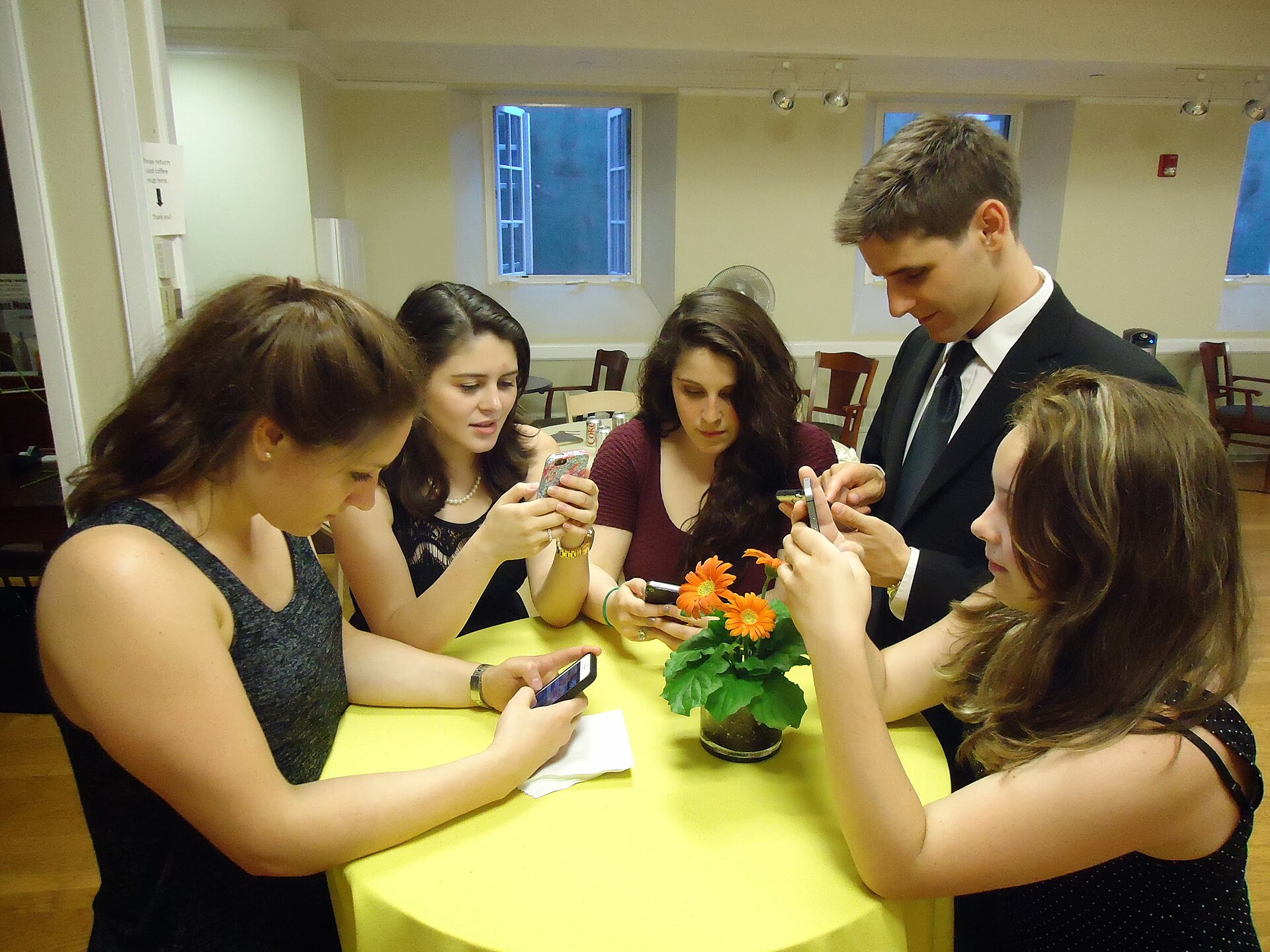 Teenagers on their phones