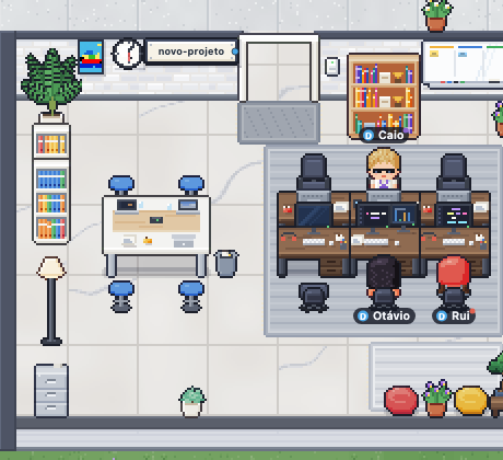 Lit room with three agents working at their desks