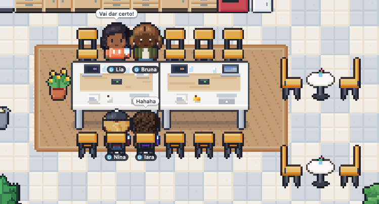 Kitchen chat: four coworkers sitting at the long table with coffee, with the bubbles 'It'll work out!' and 'Hahaha'