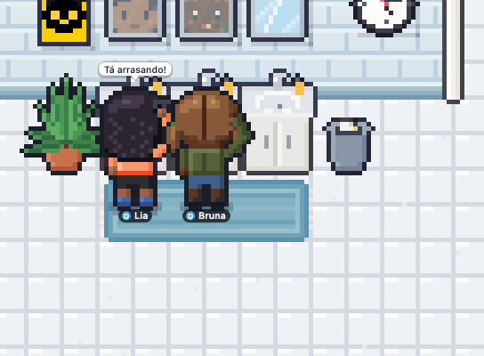 Two coworkers at the bathroom sinks freshening up, with their faces reflected in the mirrors and the bubble 'You're killing it!'