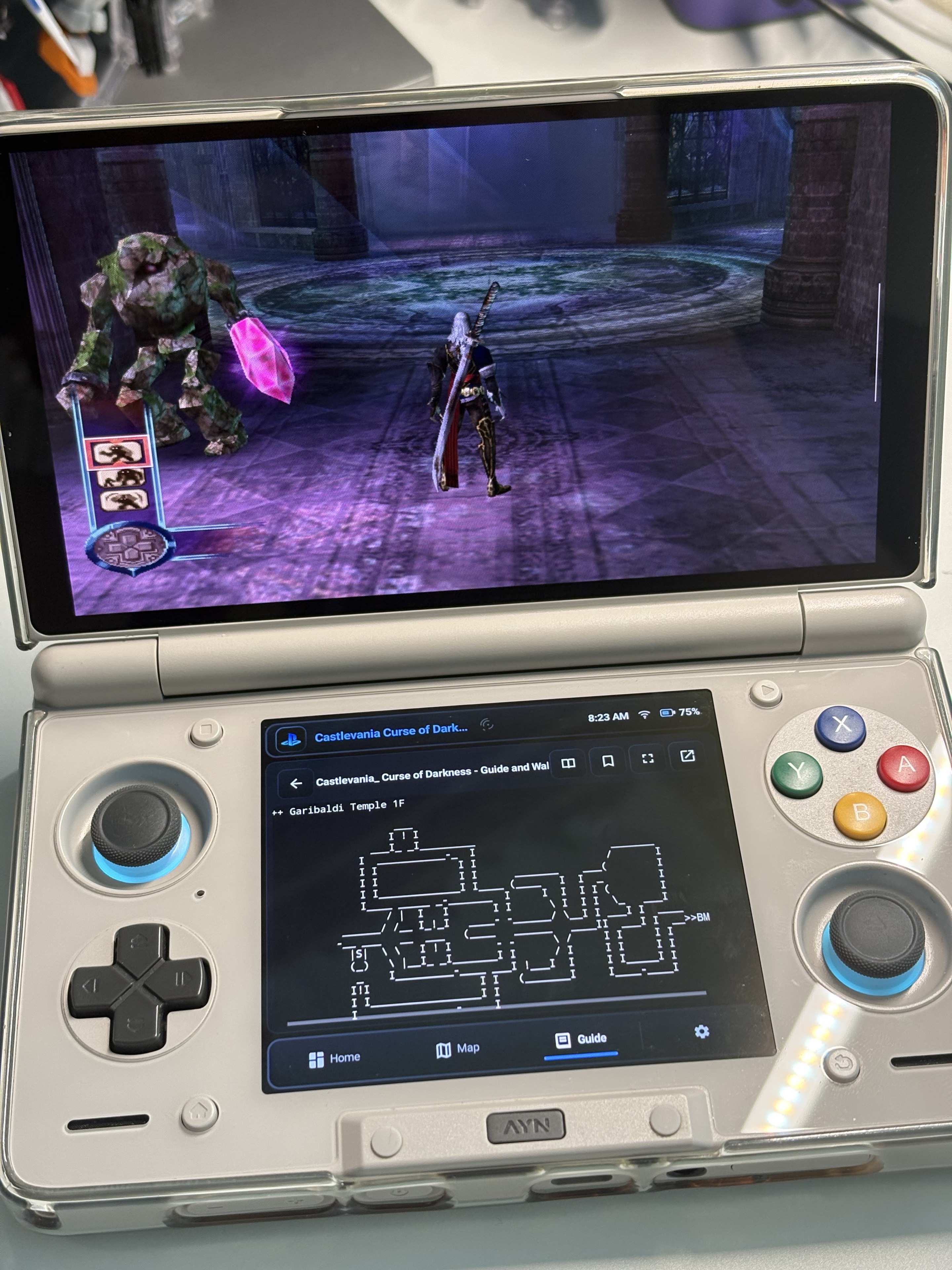 AYN Thor game on the upper screen with a local text Guide open in Heimdall on the lower screen