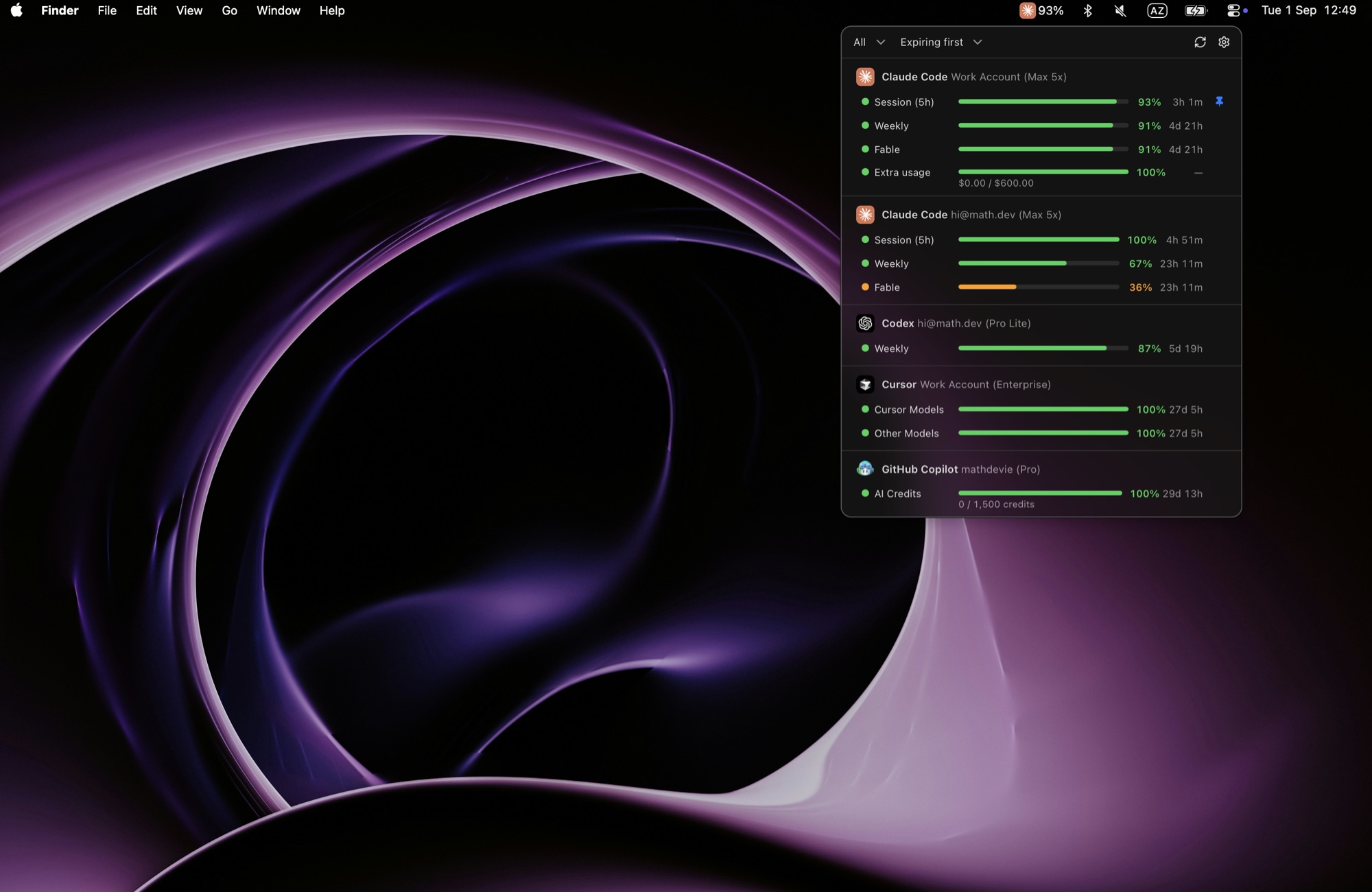 The menu bar popover over the desktop, with quotas for every account