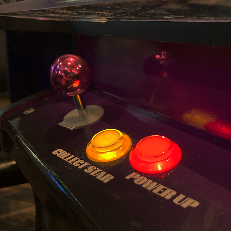 Close up of joystick and illuminated buttons