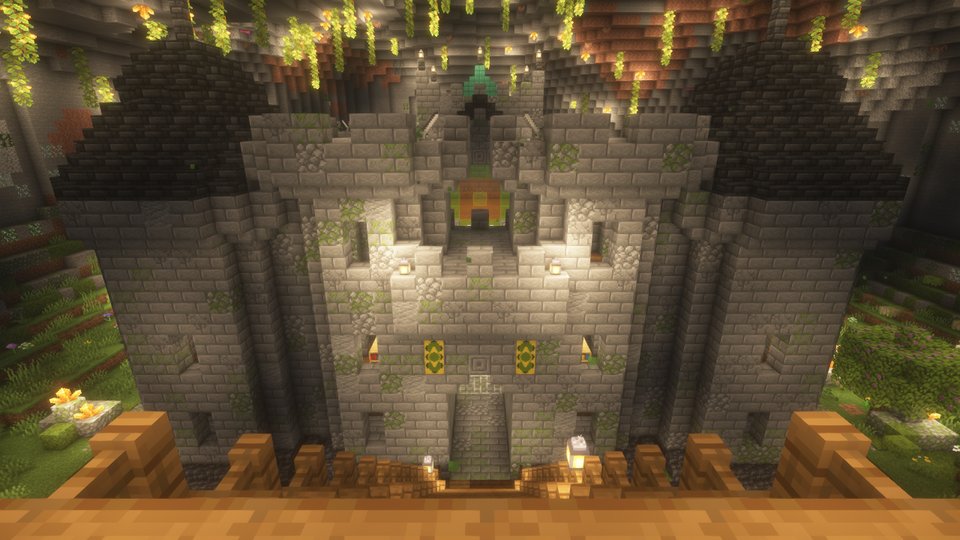 The castle seen from the balcony, sunstone glowing across the cavern