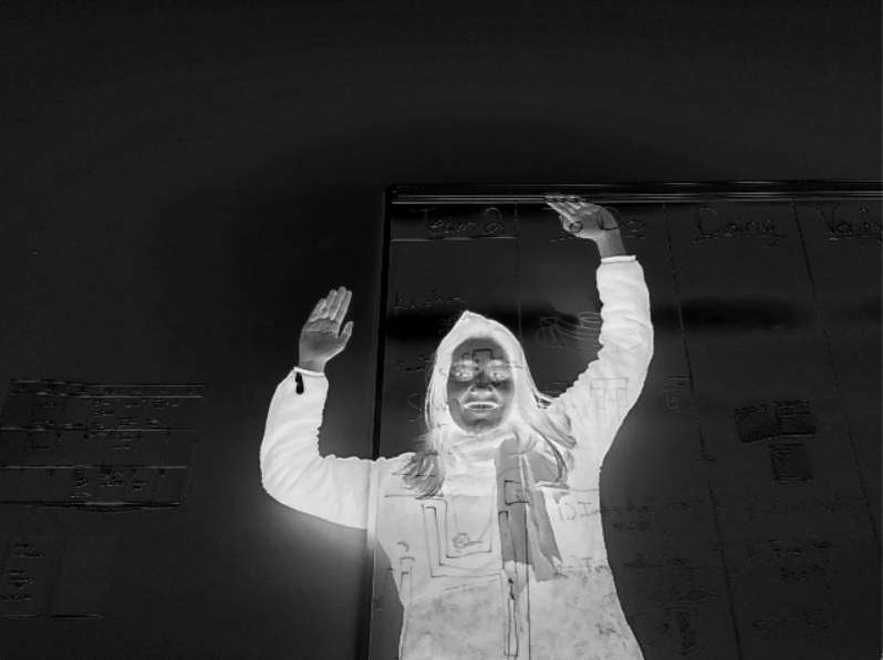 Black and white photo where person is in white