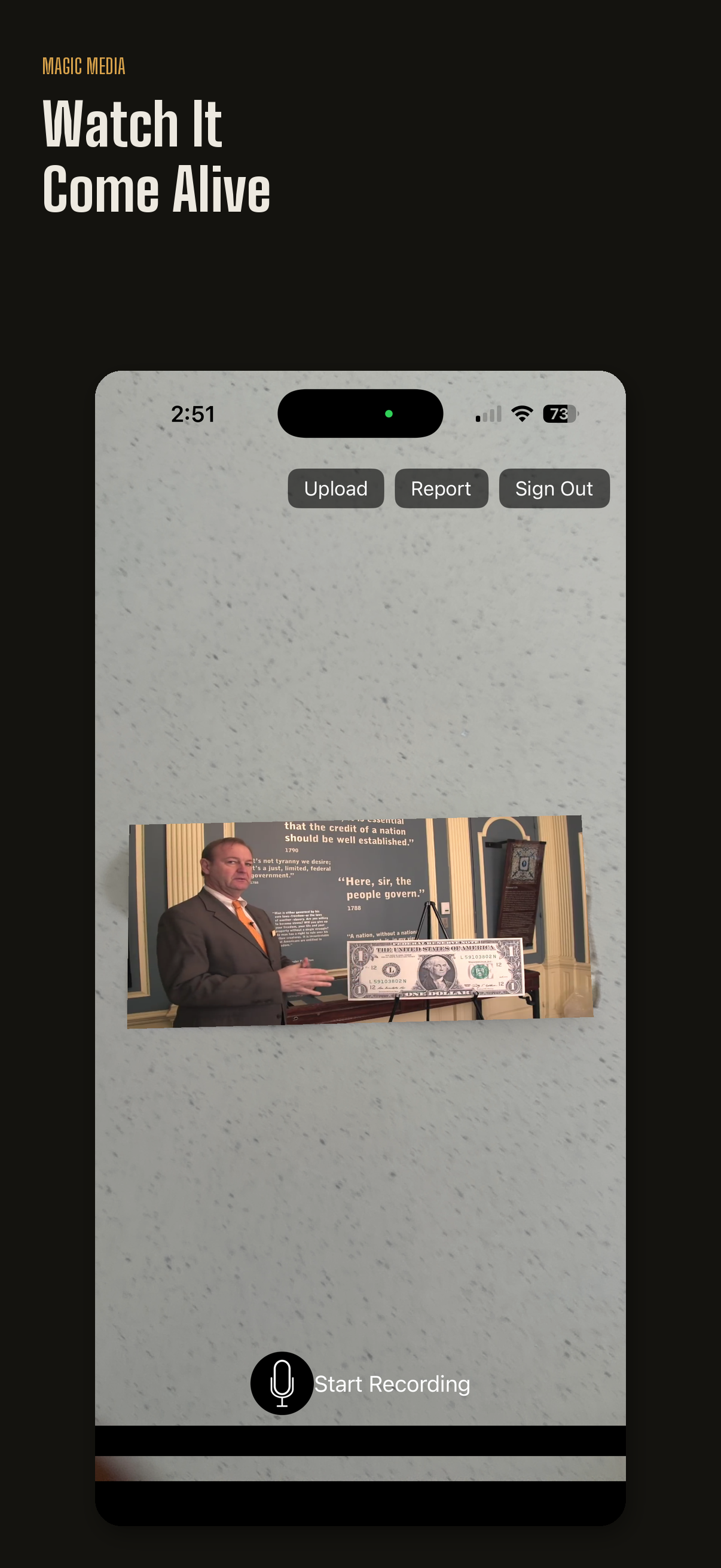 A video playing in augmented reality on top of a scanned dollar bill in the Magic Media app