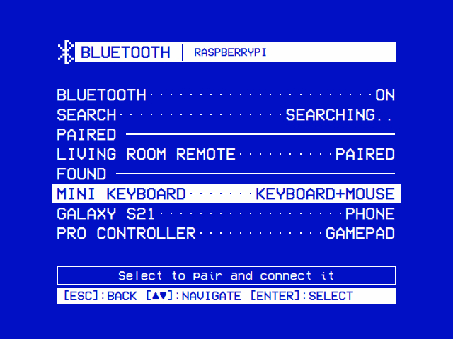 Settings → Bluetooth: BLUETOOTH ON, SEARCH SEARCHING, PAIRED: LIVING ROOM REMOTE PAIRED, FOUND: MINI KEYBOARD (KEYBOARD+MOUSE), GALAXY S21 (PHONE), PRO CONTROLLER (GAMEPAD)