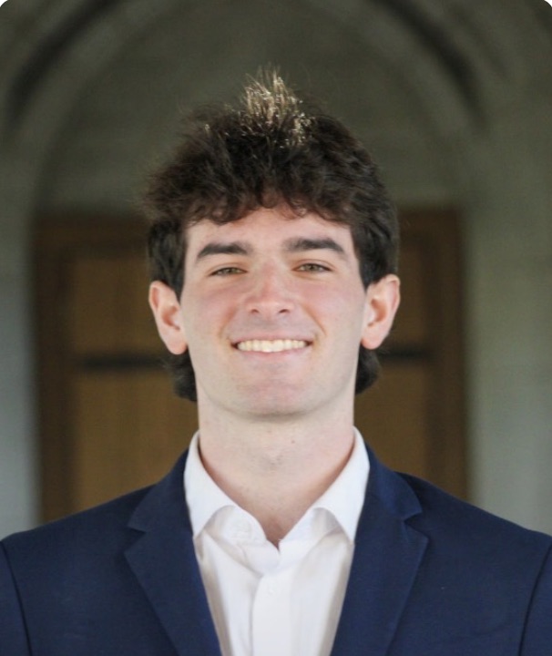 Headshot of Matt Gresock in a navy blazer and white shirt
