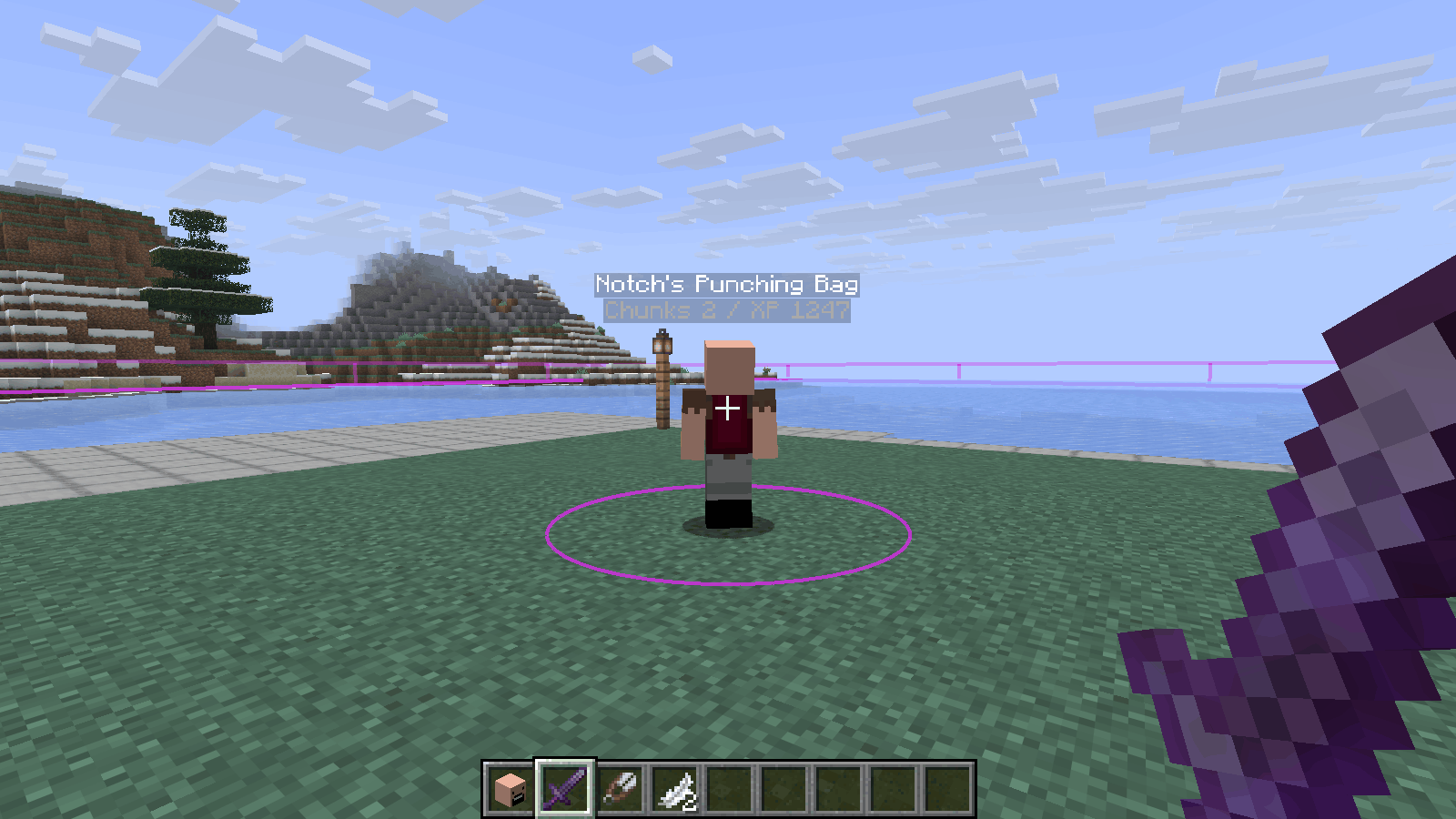 A punching bag standing in a field