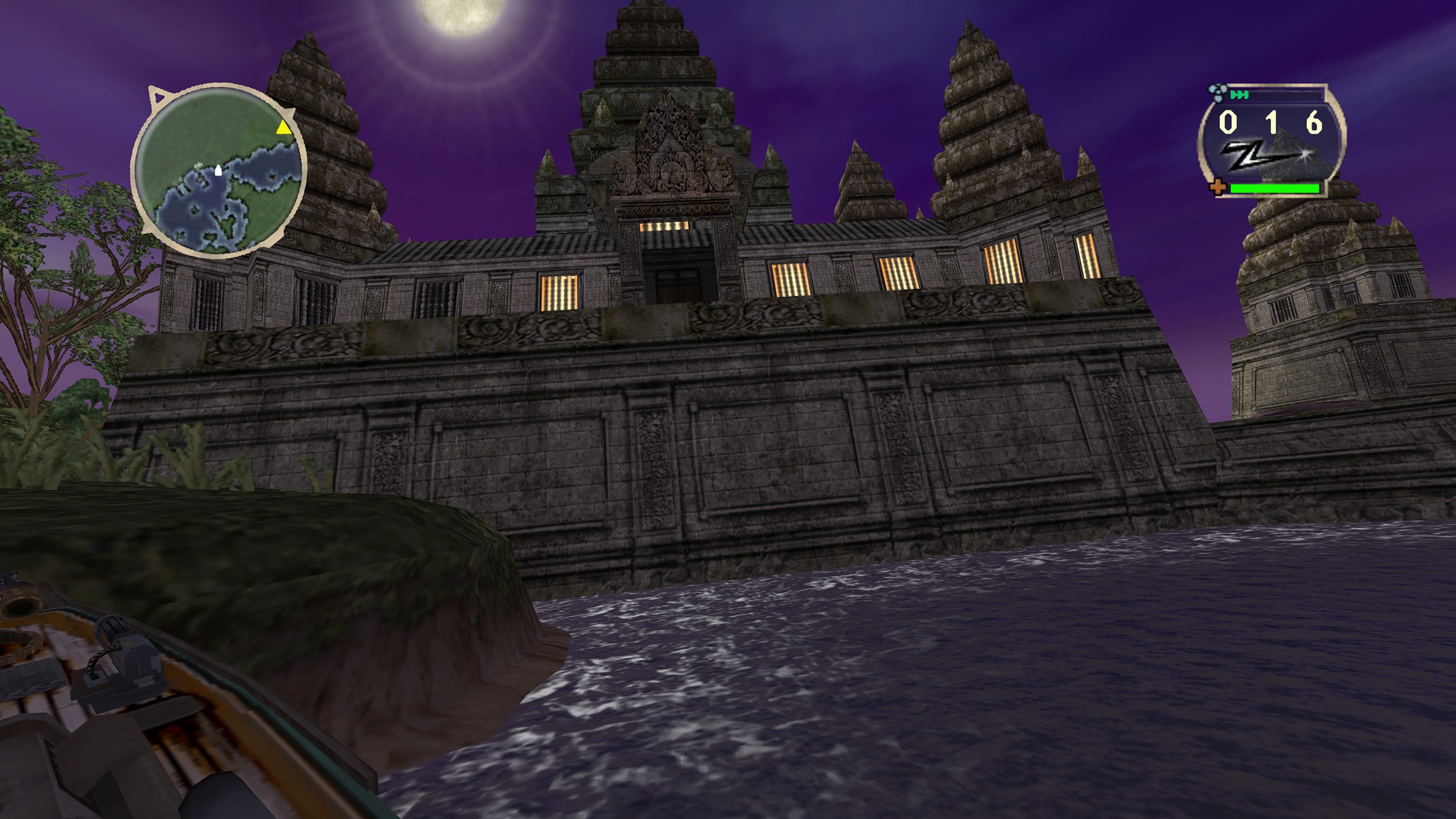 Twilight: a temple under a rising moon, seen from the cockpit