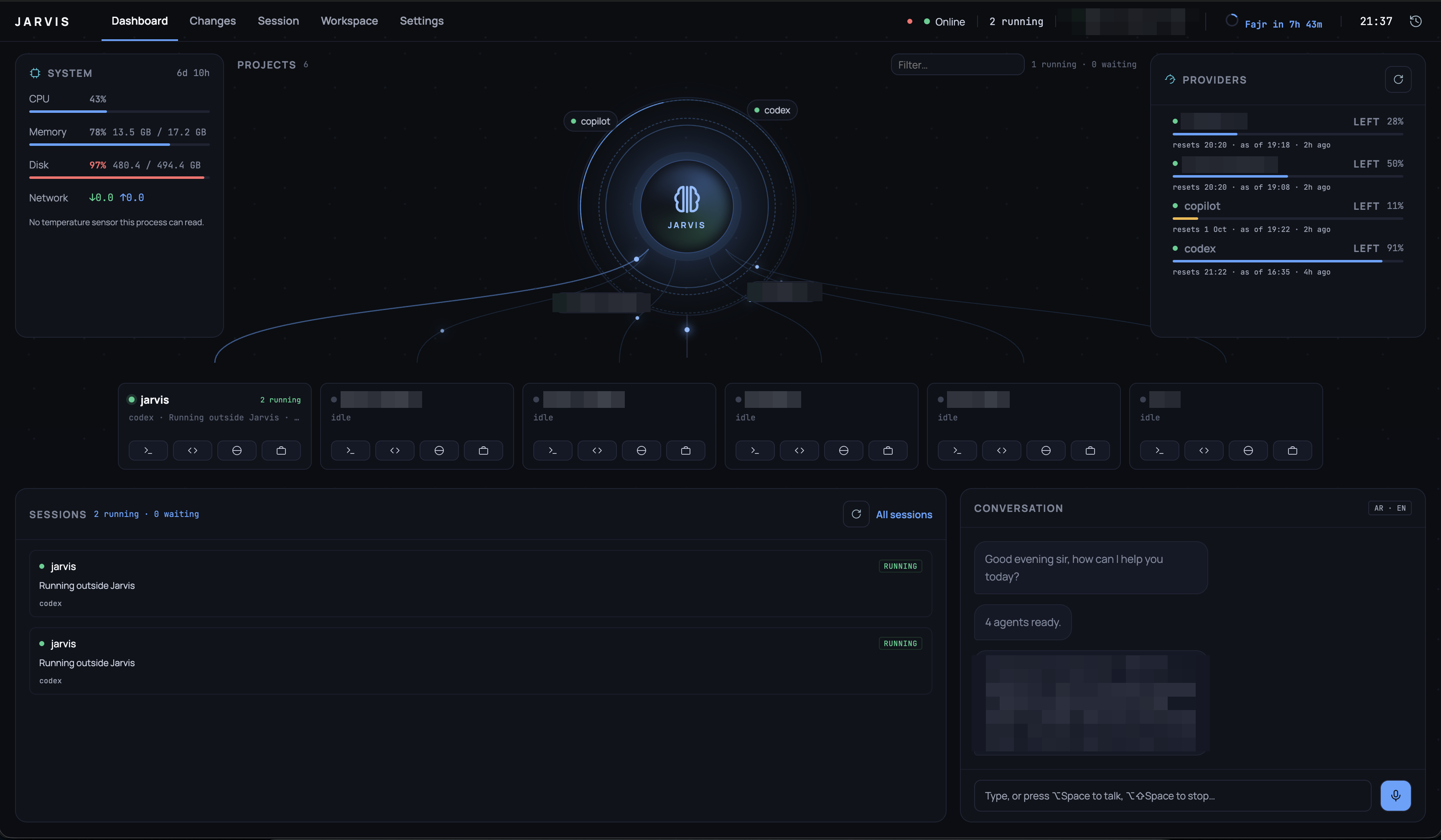 The Dashboard: machine load on the left, the JARVIS core with orbiting agents and threads down to the project cards in the middle, provider capacity on the right, sessions and the conversation below.