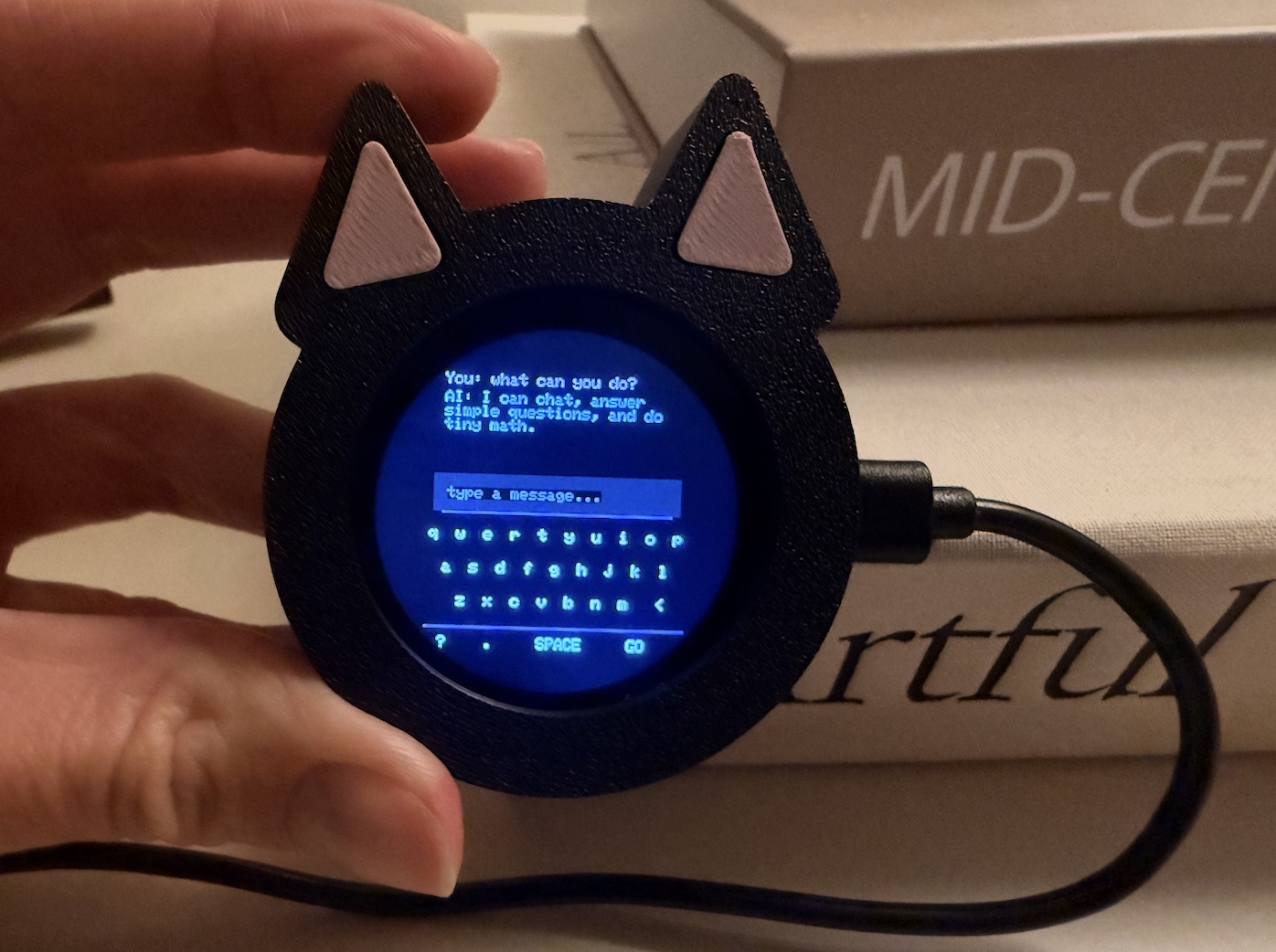 PocketGPT handheld device with its touchscreen keyboard and a recorded answer