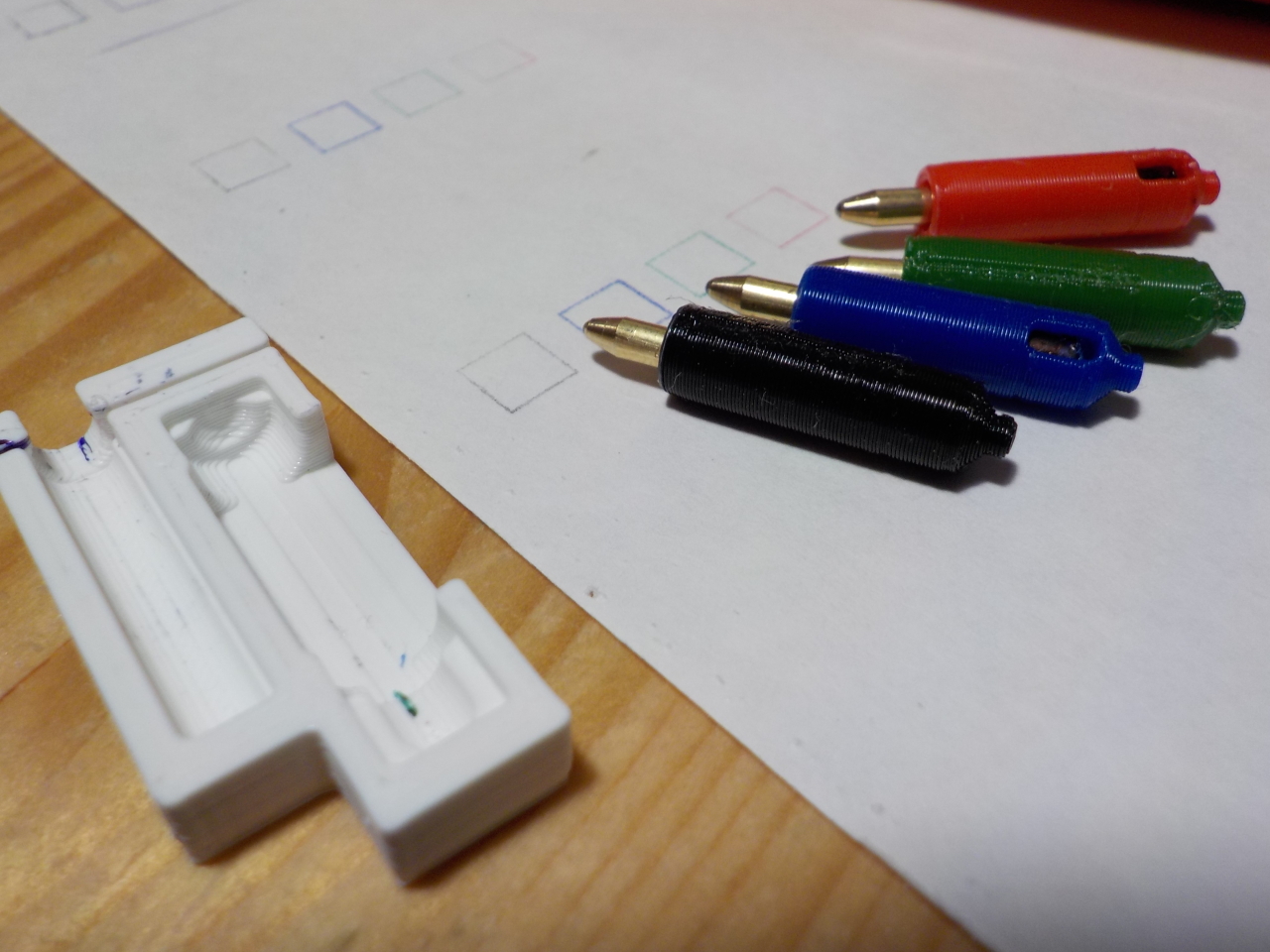 Four replacement pens assembled along with the cutting jig.