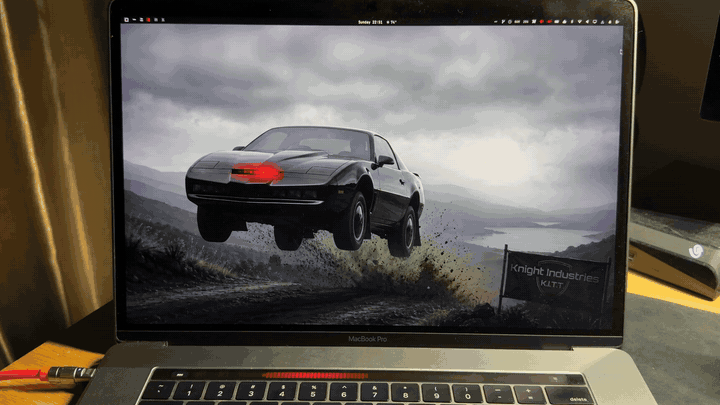 The K.I.T.T. theme running on a MacBook Pro, scanner sweeping across the Touch Bar