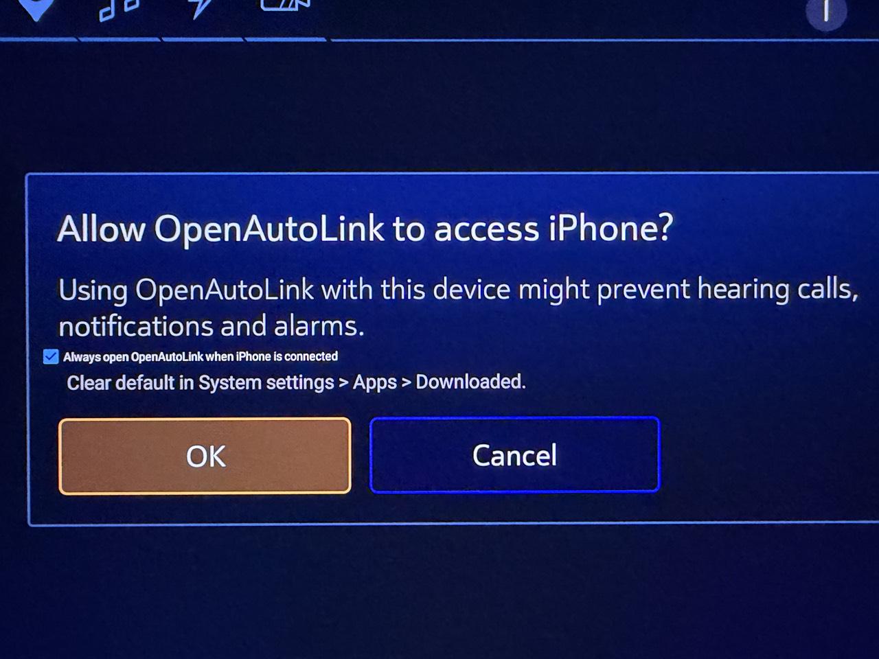GM USB access dialog asking to allow OpenAutoLink to access an iPhone, with Always open OpenAutoLink already checked and OK and Cancel buttons