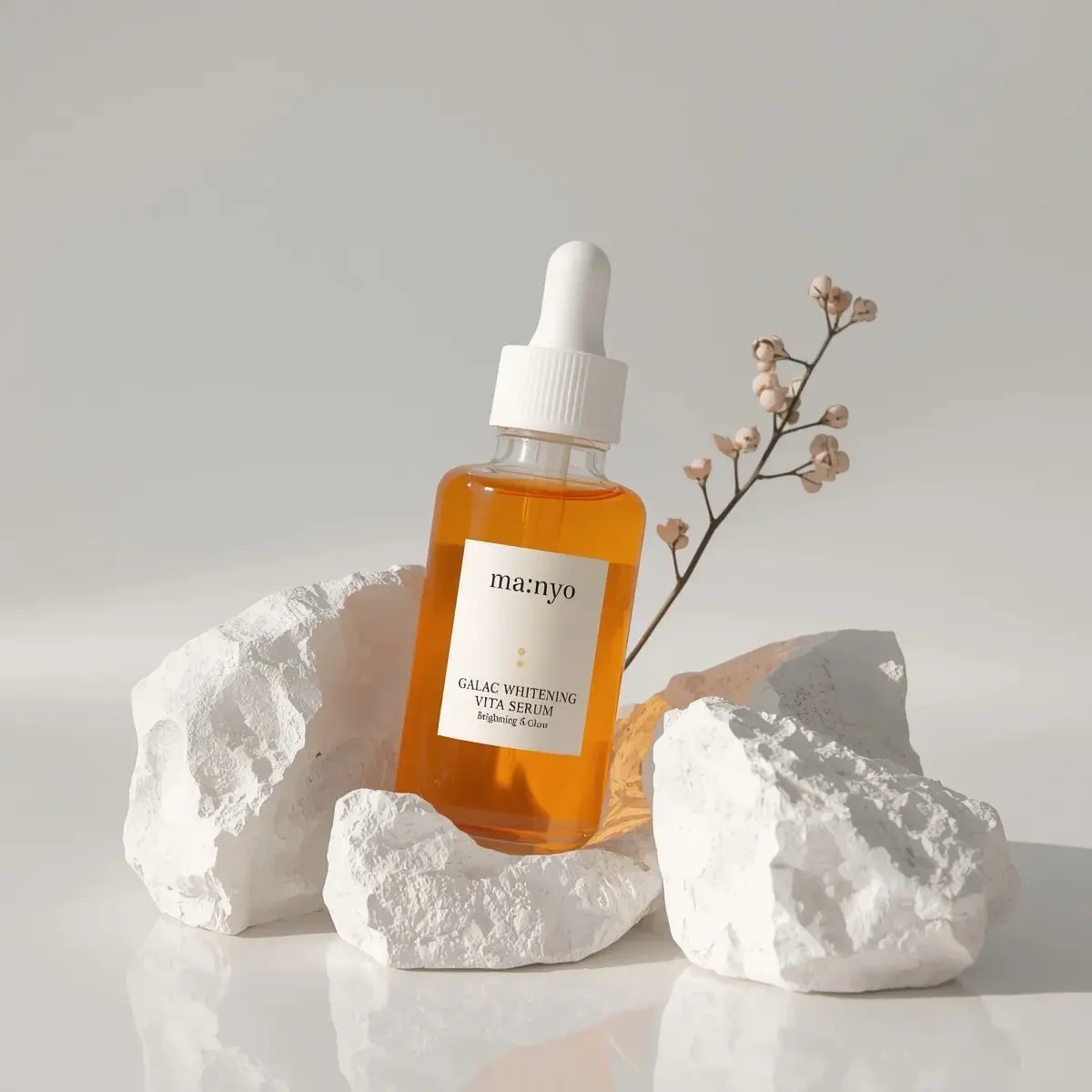 Minimalist studio product photography of an amber glass d...