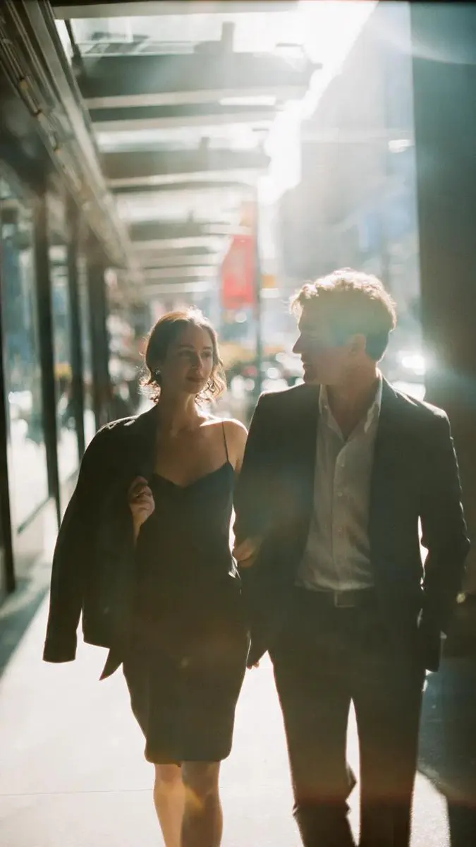 A cinematic candid medium shot portrait of a man and a wo...