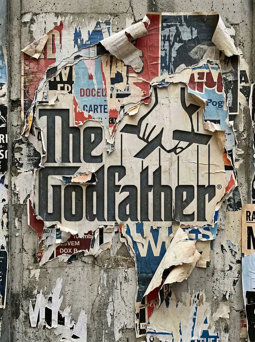 Transform the uploaded logo into a realistic urban wall s...