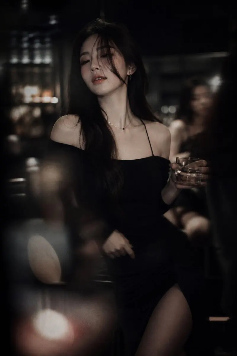 Low-light cinematic portrait, telephoto lens compression,...