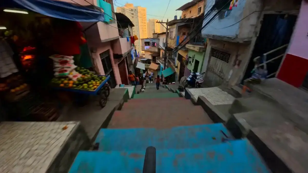 SUBJECTS: First-person cyclist, handlebars and front whee...