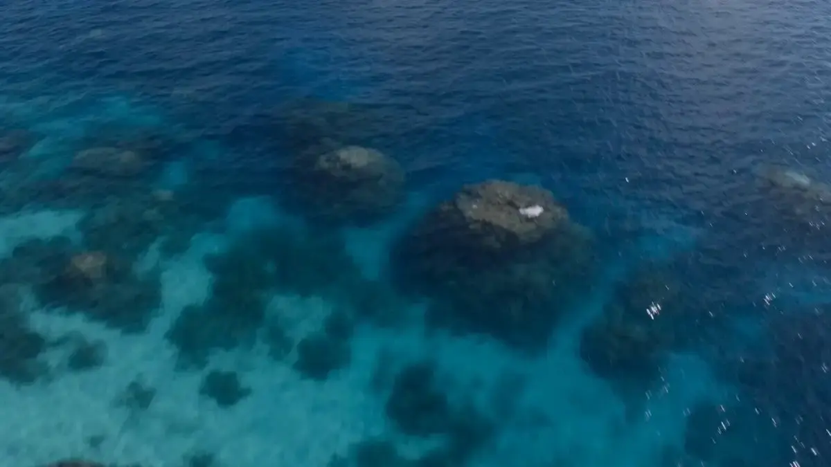 A hyper-realistic, high-cinematic aerial drone shot of a ...