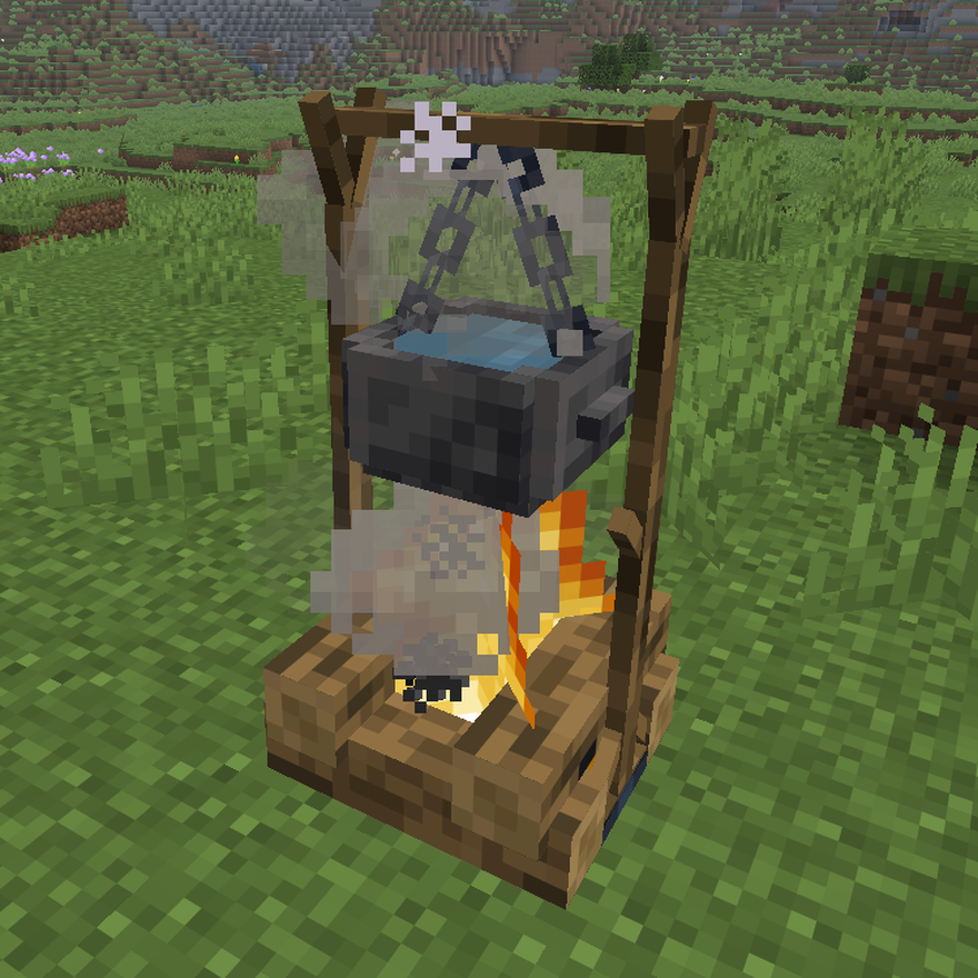 Iron Hanging Pot boiling water over a campfire