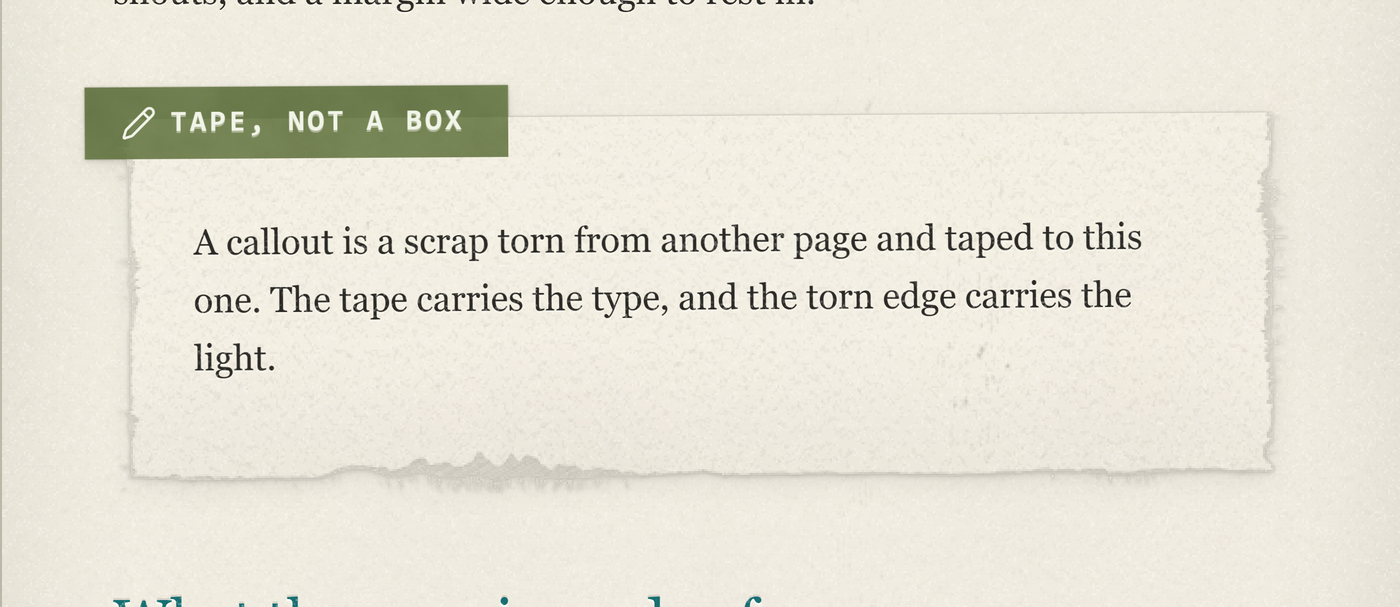 A callout: the tape, the torn edge, the paper grain