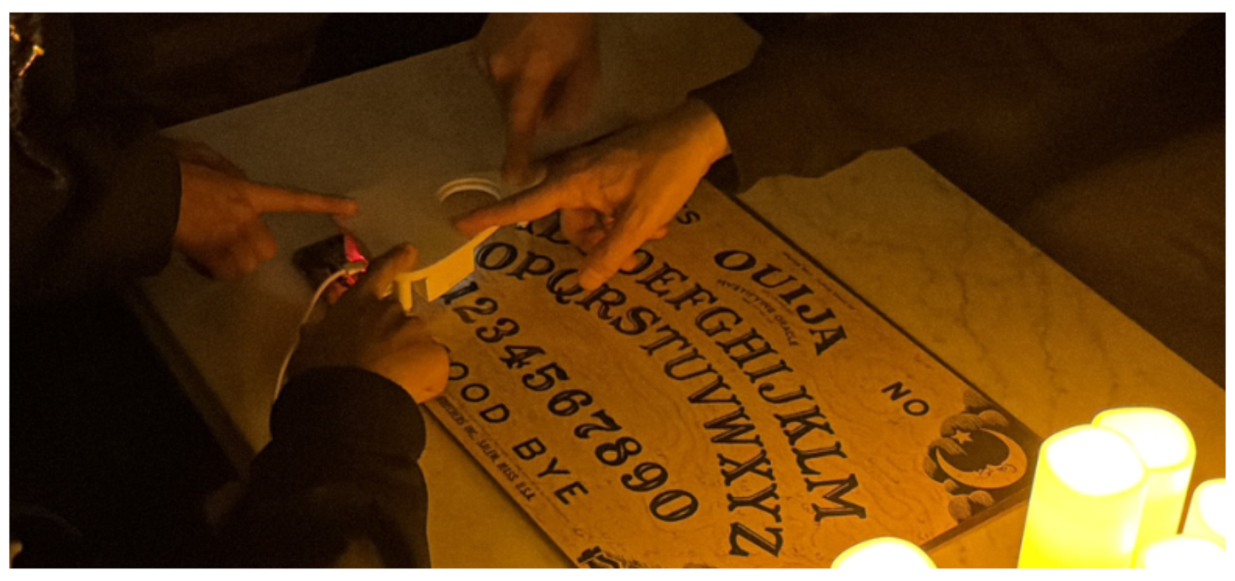 原论文 Figure 1:The motion-tracking planchette interface and Ouija board used in Host Your Ghosts.