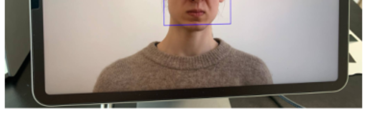 原论文 Figure 2:Interface mapping facial expressions to chord progressions with on-screen emotion display.