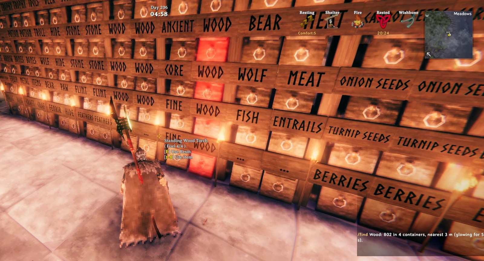 /find wood: four chests glow red in a wall of labelled chests, and the chat says 802 wood in 4 containers, nearest 3 m