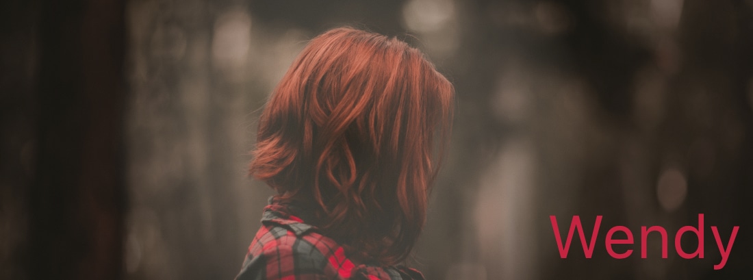 project logo. A picture of a person with long red hair.