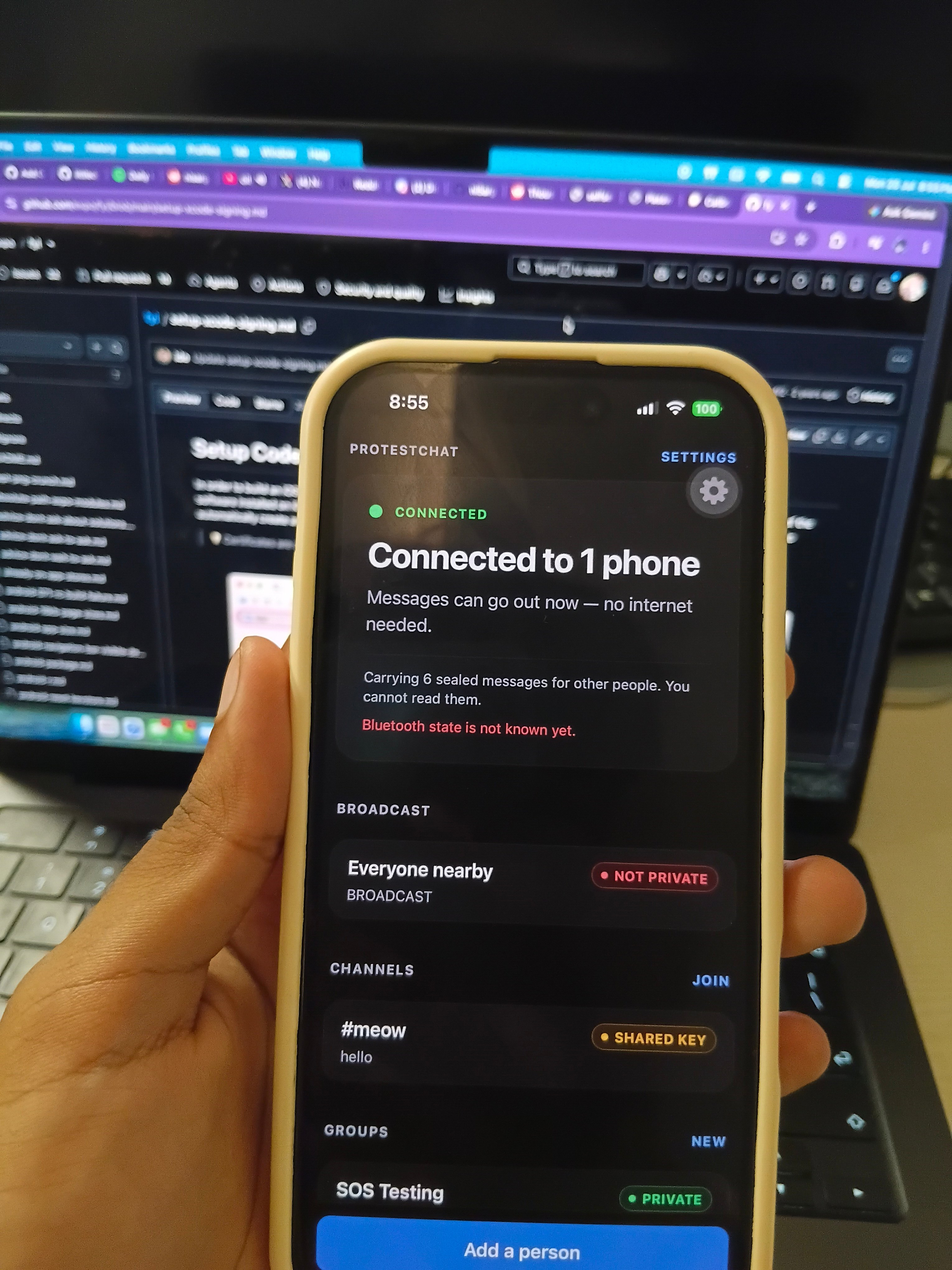 protestchat on a phone, connected to another phone nearby over Bluetooth with the internet off