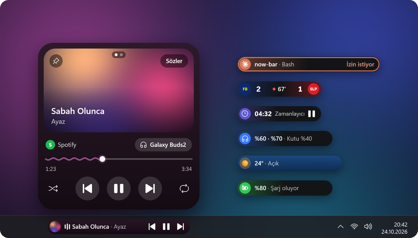 Görev çubuğunda çalan şarkının pili, üstünde açılmış müzik kartı; yanında Claude Code, maç, zamanlayıcı, Galaxy Buds, hava ve şarj pilleri