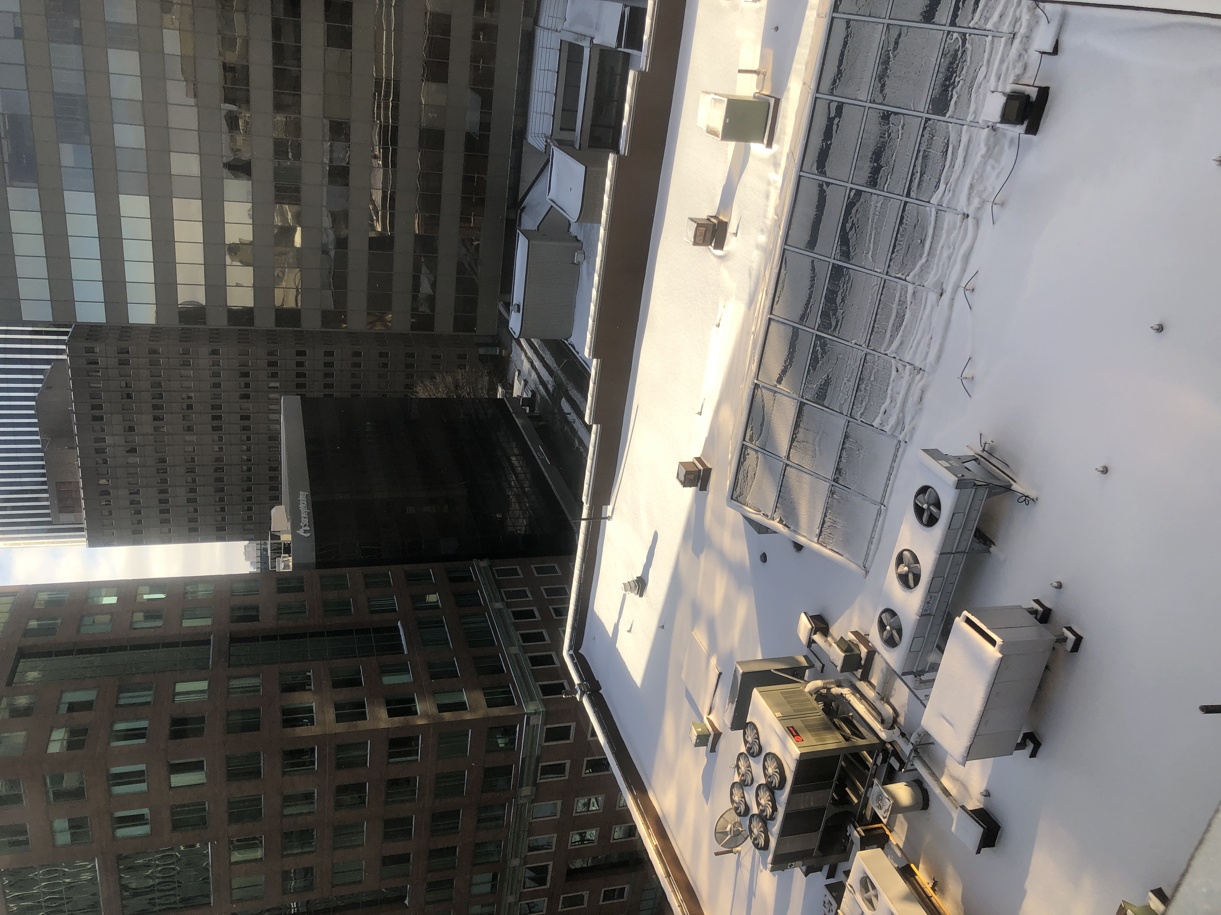 a building rooftop covered in snow