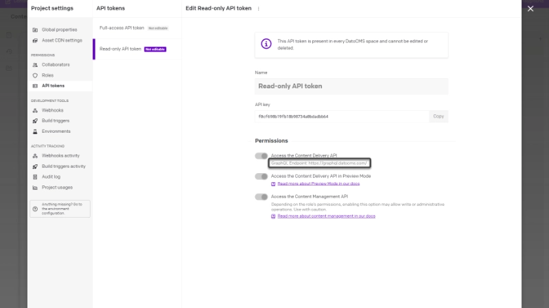 The DatoCMS API tokens settings, showing the configuration for a token named read-only API token. The API key is visible and copyable with a click, and permissions are toggled on for the GraphQL endpoing, the content delivery API in preview mode, and the content management API.