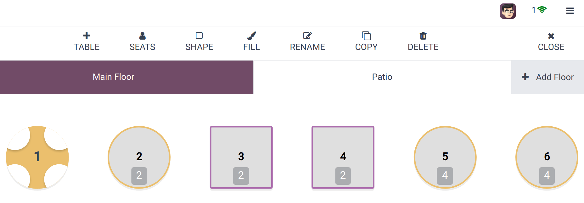 Odoo POS restaurant floor plan with numbered tables and seat counts