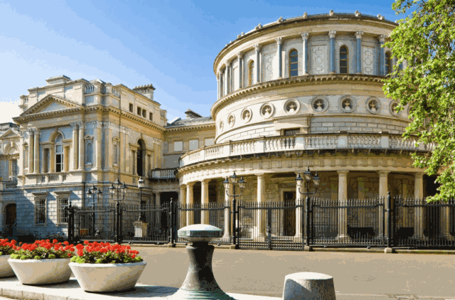 The domed rotunda of the National Museum of Ireland, Archaeology under a clear blue sky.
