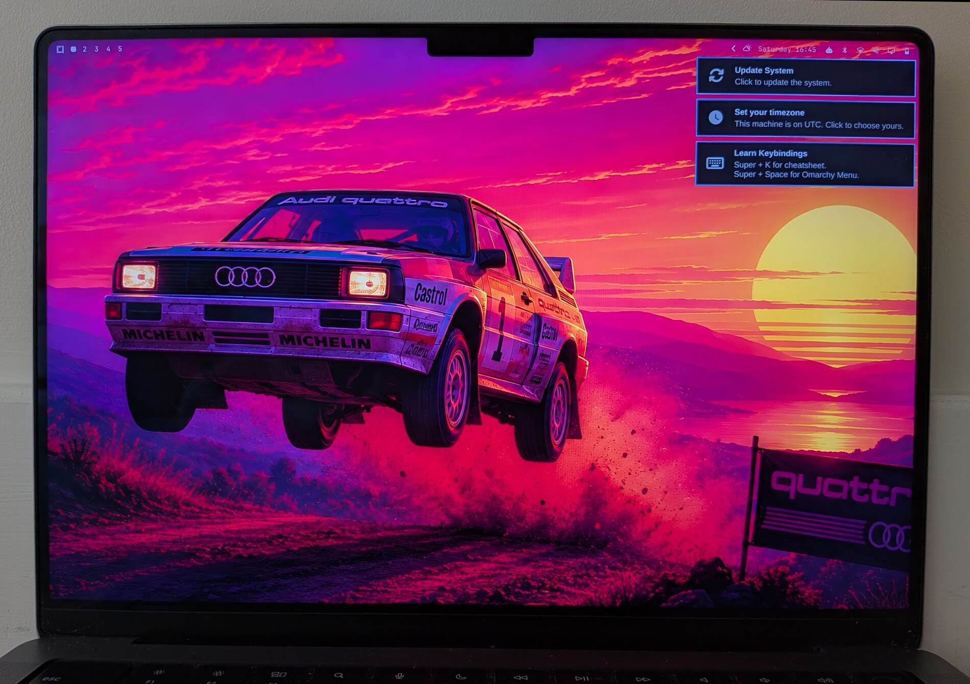 Omarchy 4 on an Apple Silicon MacBook: the top bar flowing around the display notch on a fresh install