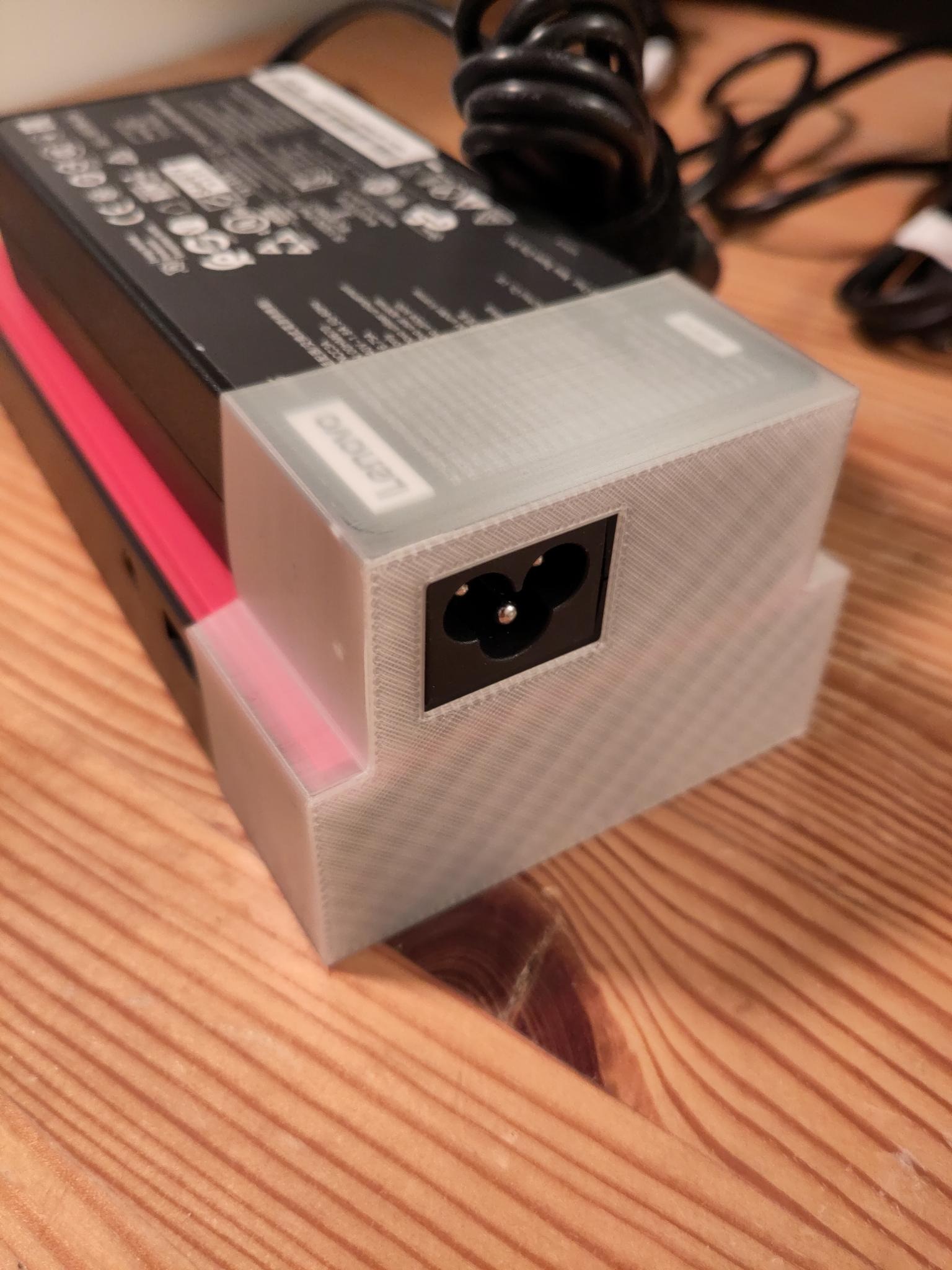 same print snuggly holding both powersupply and dock together