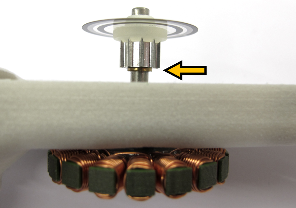 *Insert the motor shaft assembly into the stator bearing.