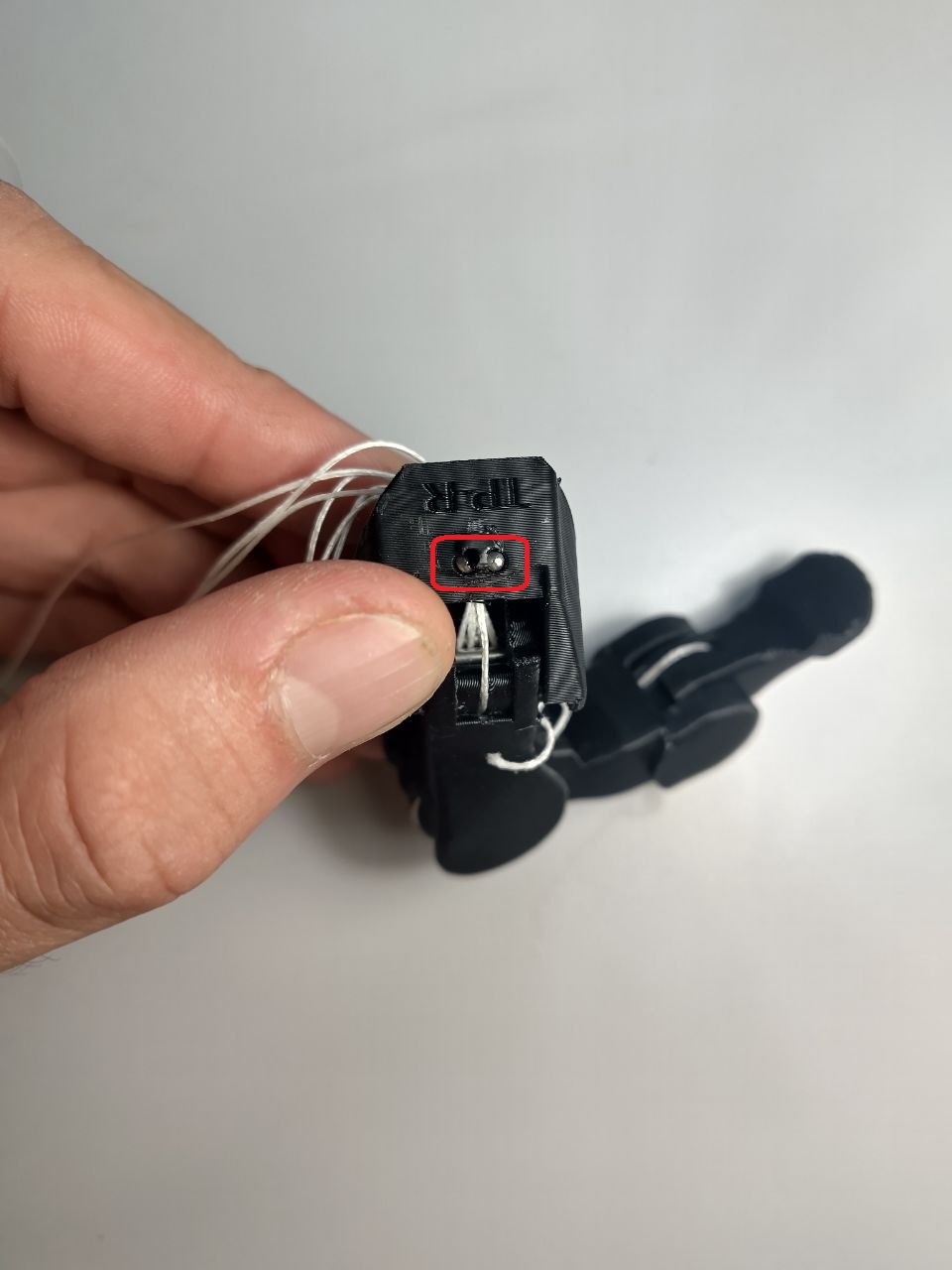 The two 2x30 pin slots on the thumb AP, highlighted in red