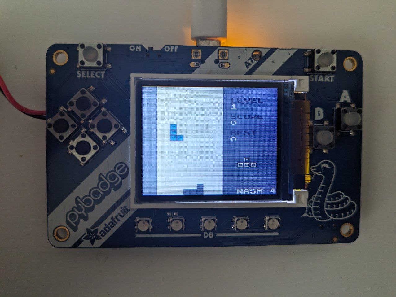 photo of pybadge running tetris