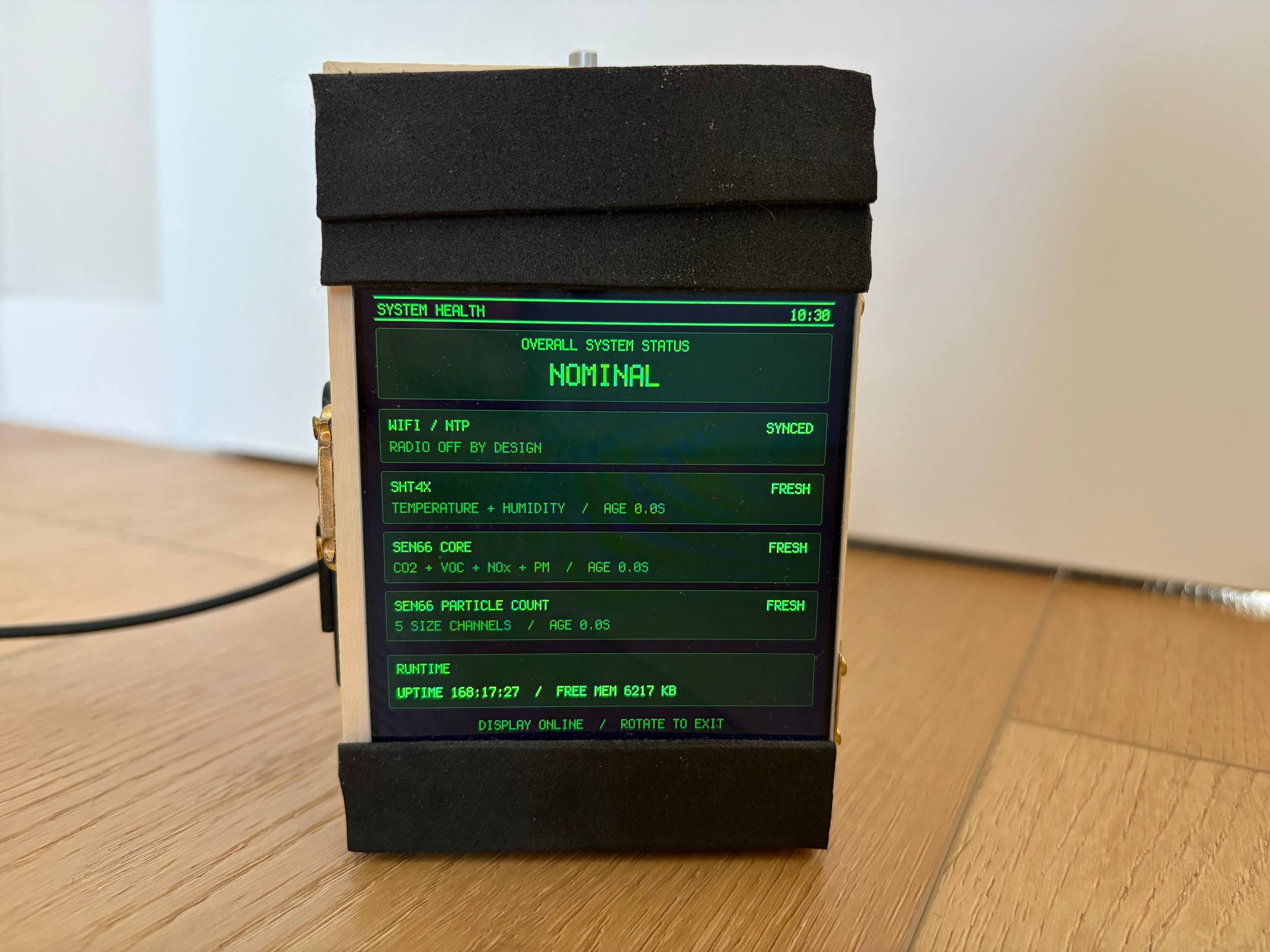 System Health screen listing WiFi/NTP SYNCED, SHT4X FRESH, SEN66 core FRESH, SEN66 particle count FRESH, uptime and free memory.