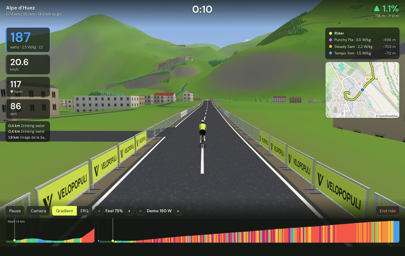 Riding through Bourg d'Oisans between crowd barriers, with buildings and side roads from OpenStreetMap