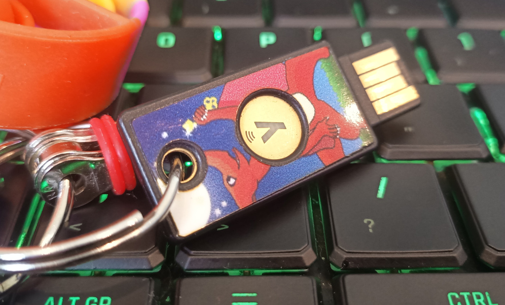 Real life picture of a printed sticker on a YubiKey 5 NFC