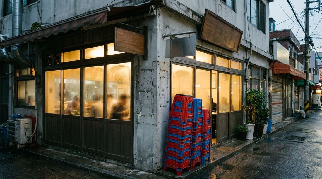 A small Korean neighborhood restaurant lit up at dinner time