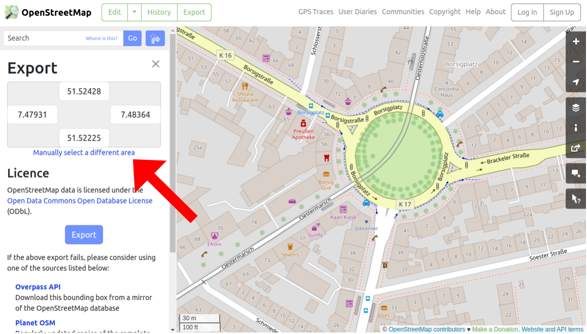 Screenshot of OpenStreetMap with an arrow pointing to the "Manually select a different area" link