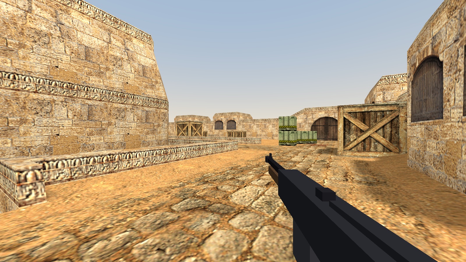 OpenStrike rendering de_dust in Pocket3D — a wide sunlit desert courtyard with arches, crates and an open sky.